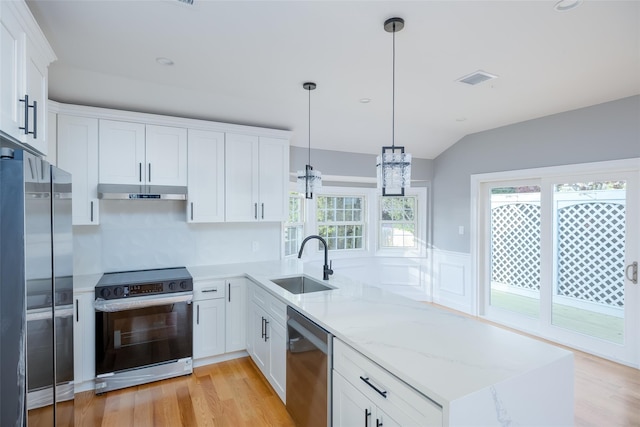 38 Bradford Ln, Bethpage, NY 11714 - kitchen featuring stainless steel appliances, a peninsula, under cabinet range hood, light wood-type flooring, and lofted ceiling