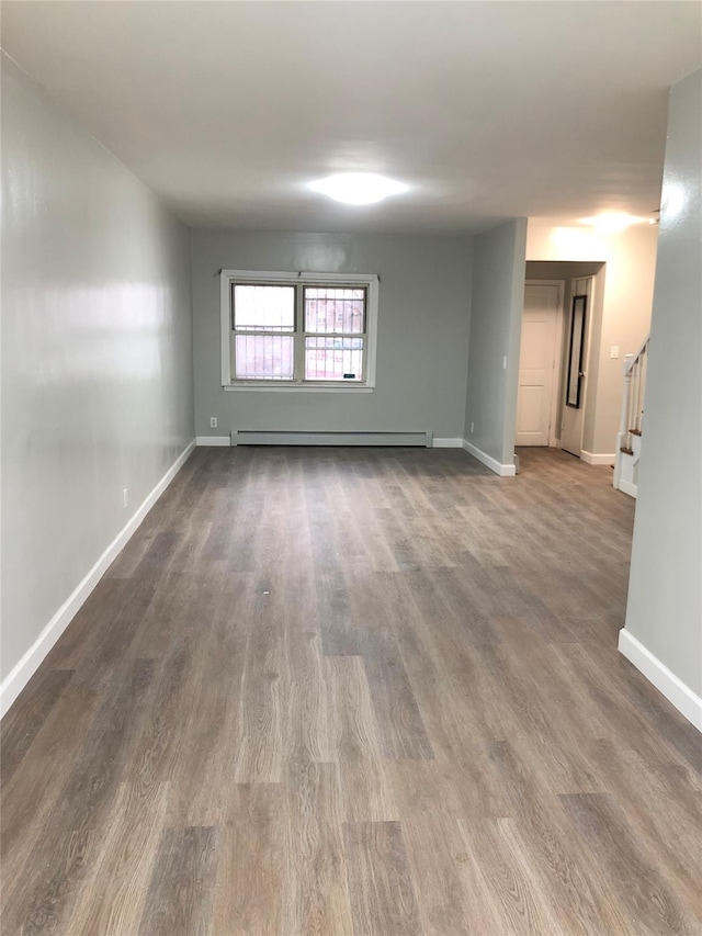 148-03 Horace Harding Expy, Flushing, NY 11367 - spare room with a baseboard radiator, dark wood finished floors, and stairway