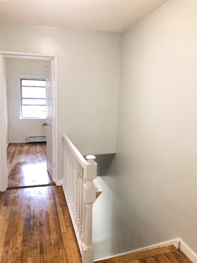 148-03 Horace Harding Expy, Flushing, NY 11367 - hall featuring an upstairs landing, wood finished floors, and a baseboard radiator