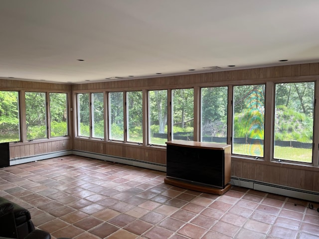 77 Montauk Hwy, Westhampton, NY 11977 - unfurnished sunroom featuring baseboard heating and wooden walls