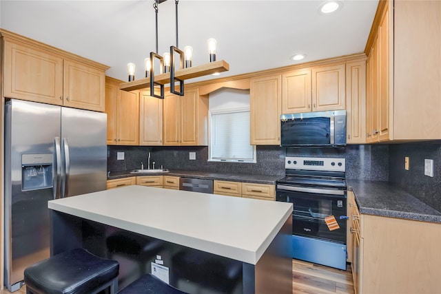 406 Red Maple Dr W, Wantagh, NY 11793 - kitchen featuring appliances with stainless steel finishes, light brown cabinetry, a kitchen bar, tasteful backsplash, and a kitchen island