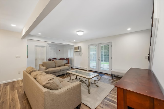 406 Red Maple Dr W, Wantagh, NY 11793 - living area with a baseboard radiator, french doors, light wood finished floors, recessed lighting, and a wall mounted air conditioner