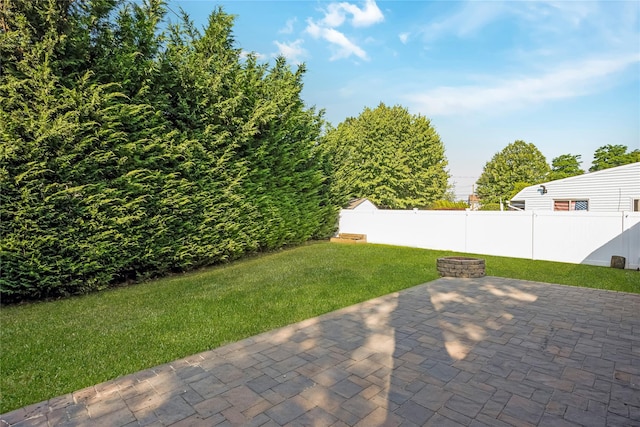 406 Red Maple Dr W, Wantagh, NY 11793 - fenced backyard with a patio area