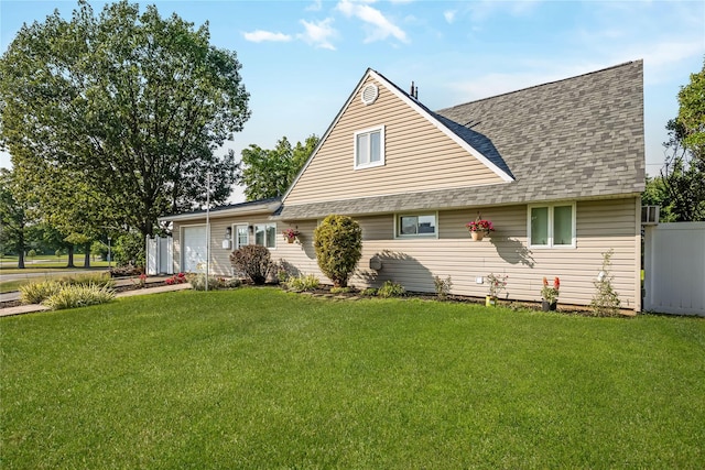 406 Red Maple Dr W, Wantagh, NY 11793 - view of front facade with an attached garage, a front yard, roof with shingles, and driveway