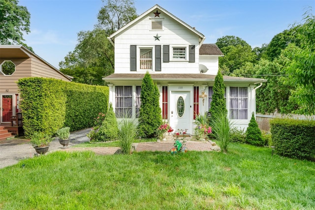 110 Pine Ave, Ossining, NY 10562 - view of front of home featuring a front lawn and a shingled roof