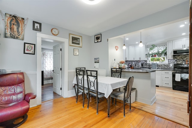 110 Pine Ave, Ossining, NY 10562 - dining room with light wood-type flooring and recessed lighting