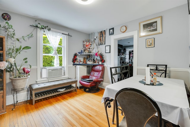 110 Pine Ave, Ossining, NY 10562 - dining room with cooling unit, radiator, and hardwood / wood-style floors