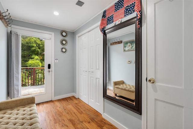 110 Pine Ave, Ossining, NY 10562 - doorway with crown molding, light wood-type flooring, and recessed lighting