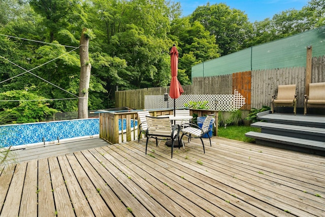 110 Pine Ave, Ossining, NY 10562 - wooden deck with an outdoor pool, a fenced backyard, and outdoor dining area