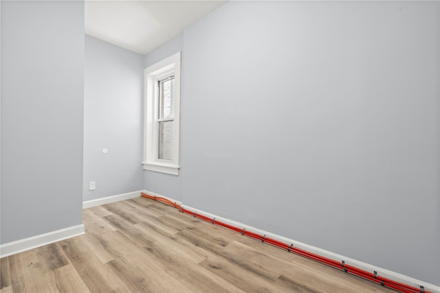 123 Elm St, Yonkers, NY 10701 - spare room with baseboards and light wood finished floors