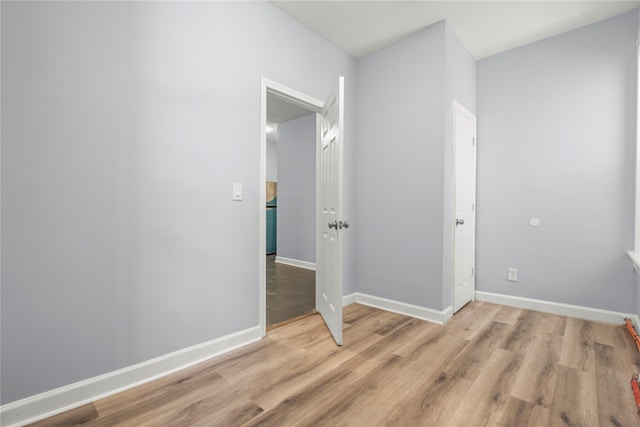 123 Elm St, Yonkers, NY 10701 - unfurnished room with wood finished floors and baseboards