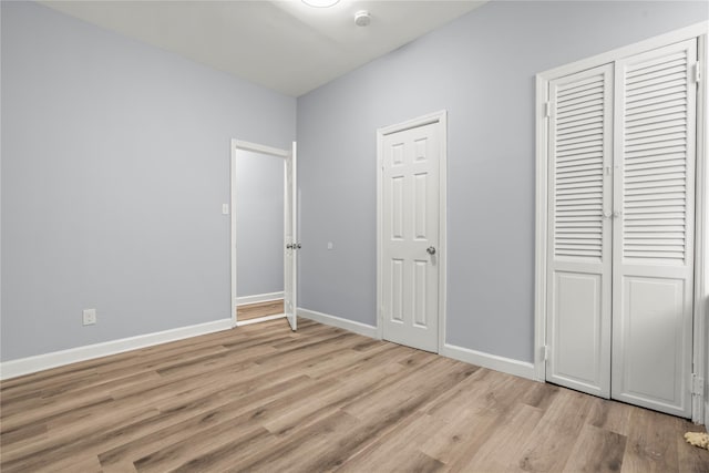 123 Elm St, Yonkers, NY 10701 - unfurnished bedroom featuring light wood-style floors and a closet