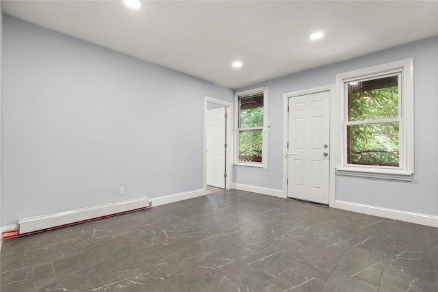 123 Elm St, Yonkers, NY 10701 - empty room featuring a baseboard heating unit, recessed lighting, and marble finish floors