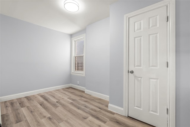 123 Elm St, Yonkers, NY 10701 - empty room with light wood-style floors and baseboards