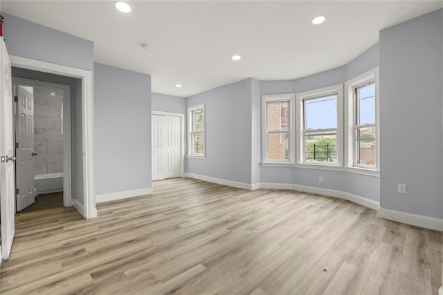 123 Elm St, Yonkers, NY 10701 - unfurnished bedroom featuring light wood-style flooring, recessed lighting, and a closet