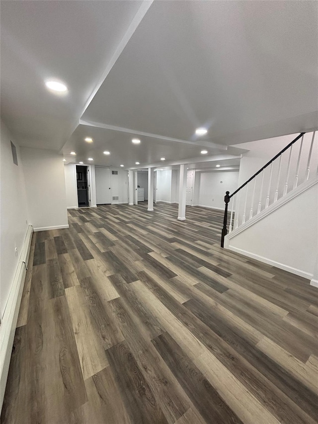 868 Oliver Ave, Westbury, NY 11590 - basement featuring stairway, dark wood finished floors, and recessed lighting