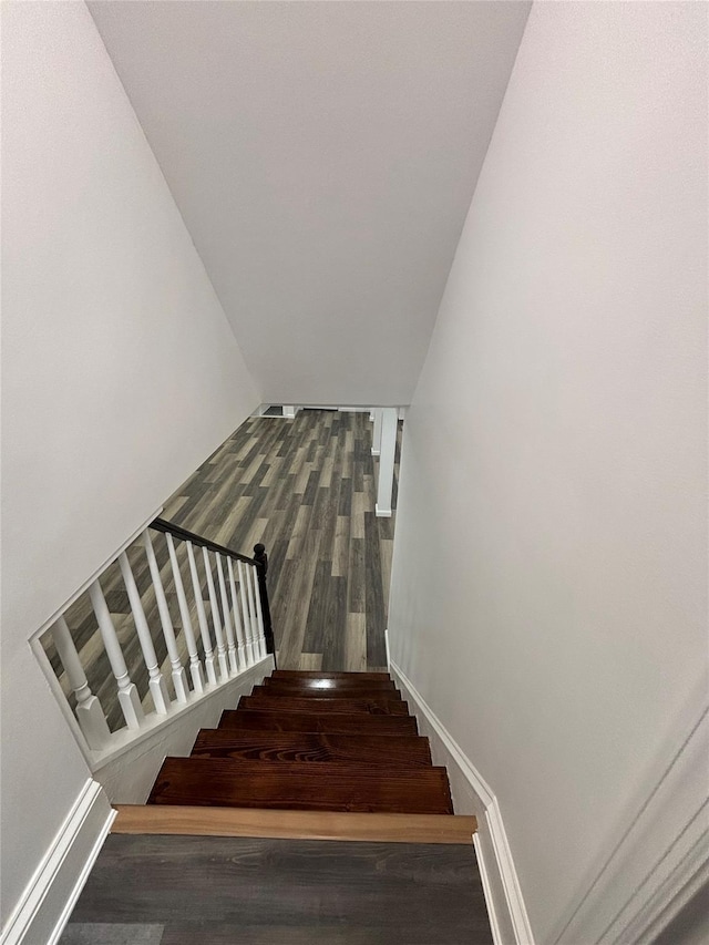 868 Oliver Ave, Westbury, NY 11590 - stairway with wood finished floors and baseboards
