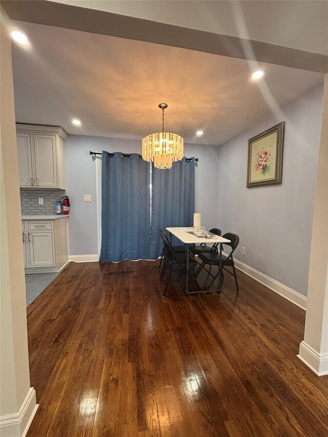 868 Oliver Ave, Westbury, NY 11590 - dining area with dark wood finished floors, a chandelier, and recessed lighting
