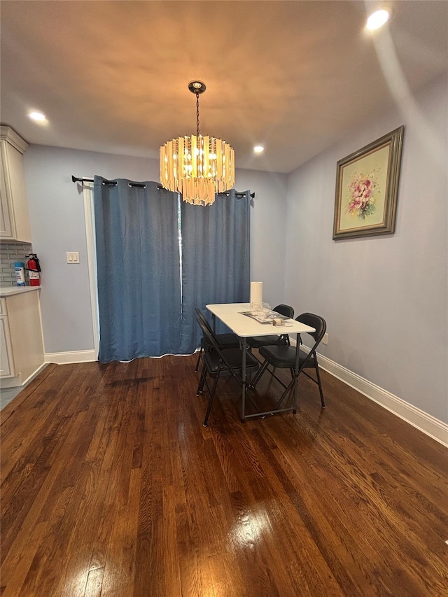 868 Oliver Ave, Westbury, NY 11590 - dining room with dark wood-style floors, a chandelier, and recessed lighting