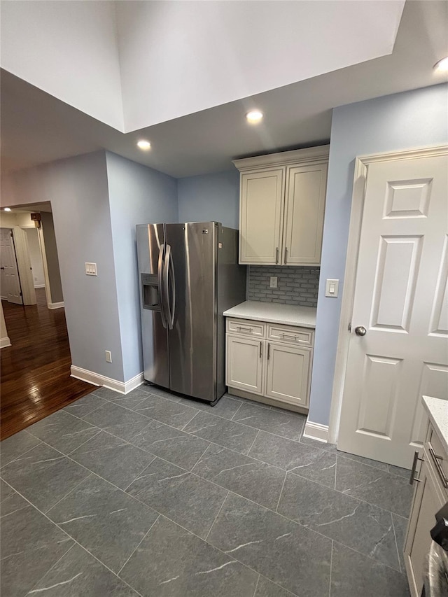 868 Oliver Ave, Westbury, NY 11590 - kitchen featuring stainless steel refrigerator with ice dispenser, recessed lighting, light countertops, decorative backsplash, and gray cabinets