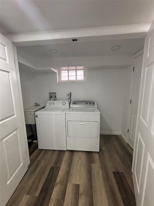 868 Oliver Ave, Westbury, NY 11590 - washroom featuring washer and dryer and dark wood finished floors
