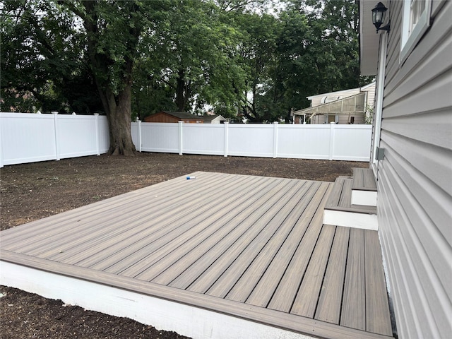 868 Oliver Ave, Westbury, NY 11590 - wooden terrace with a fenced backyard and view of wooded area