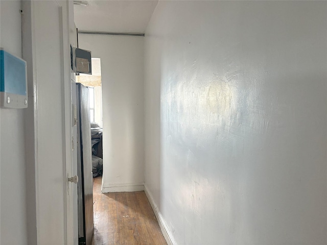 24-65 38th St Unit D10, Astoria, NY 11103 - hallway featuring wood finished floors and baseboards
