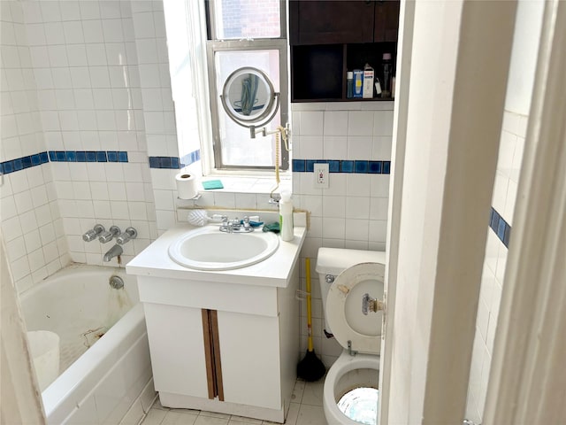 24-65 38th St Unit D10, Astoria, NY 11103 - bathroom with vanity, tub / shower combination, and tile walls