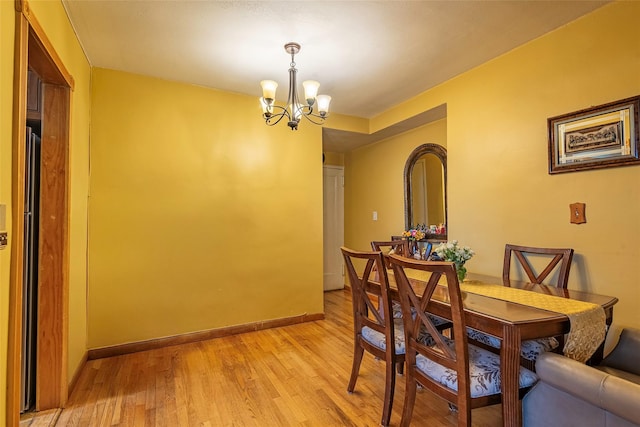 144-45 Sanford Ave Unit 6B, Flushing, NY 11355 - dining space featuring a chandelier and light wood-style floors