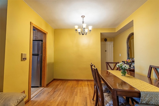 144-45 Sanford Ave Unit 6B, Flushing, NY 11355 - dining area with a chandelier and light wood-type flooring