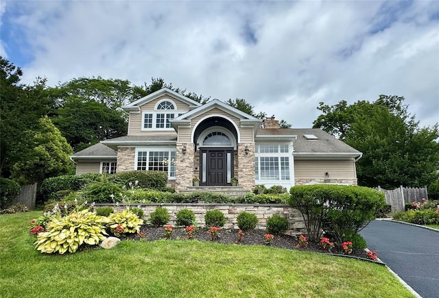 10 Hazelwood Ct, Jericho, NY 11753 - view of front facade with stone siding and a chimney