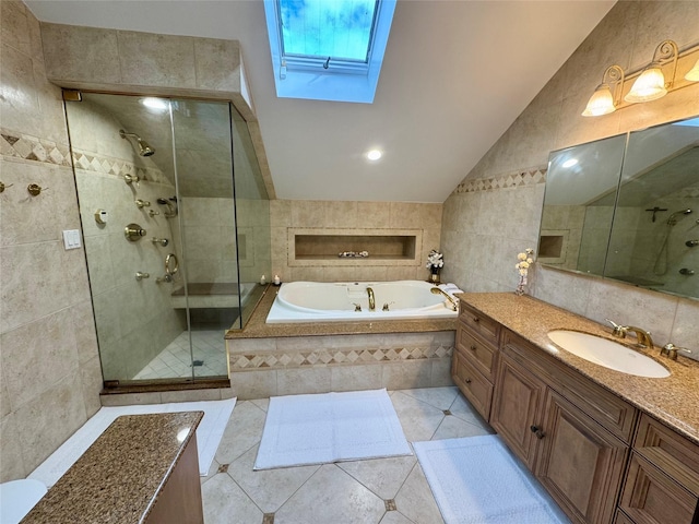 10 Hazelwood Ct, Jericho, NY 11753 - full bath featuring a skylight, a stall shower, a bath, vanity, and tile walls