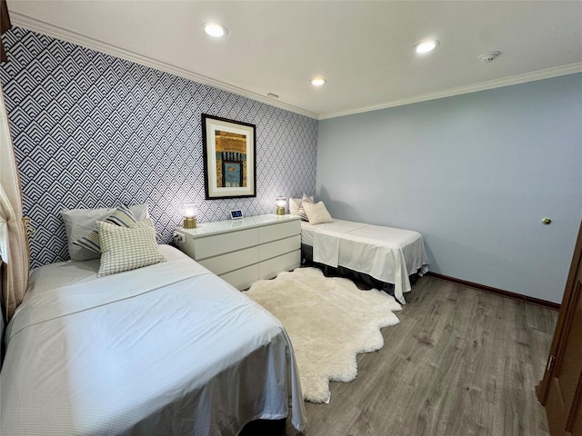 10 Hazelwood Ct, Jericho, NY 11753 - bedroom with ornamental molding, wood finished floors, recessed lighting, and an accent wall