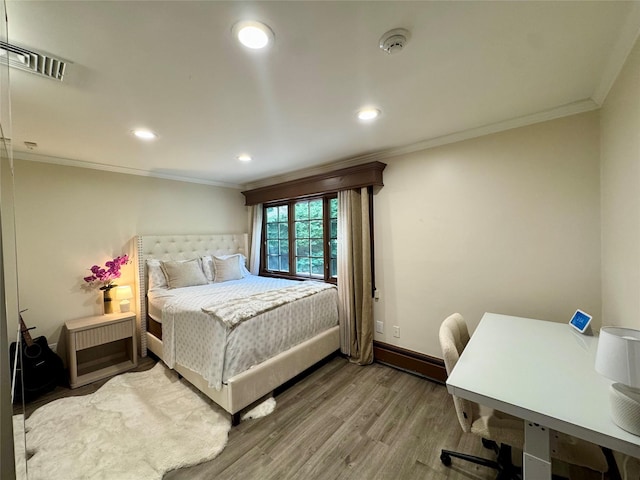 10 Hazelwood Ct, Jericho, NY 11753 - bedroom featuring ornamental molding, wood finished floors, recessed lighting, and a desk