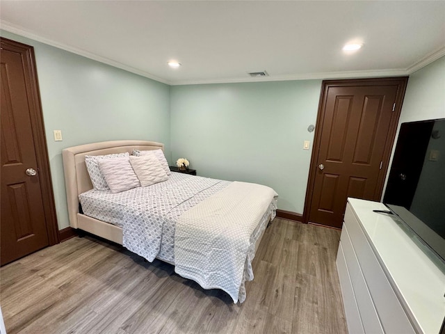 10 Hazelwood Ct, Jericho, NY 11753 - bedroom featuring light wood finished floors, recessed lighting, and ornamental molding