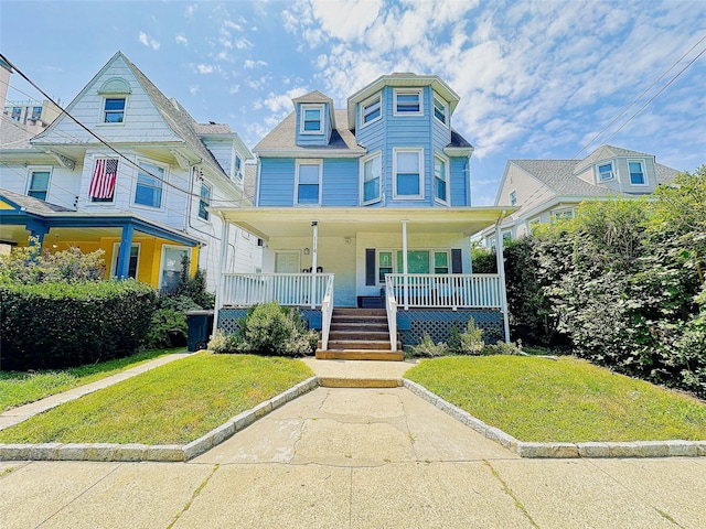 114 Park Ave, Mount Vernon, NY 10550 - victorian-style house with a porch and a front yard
