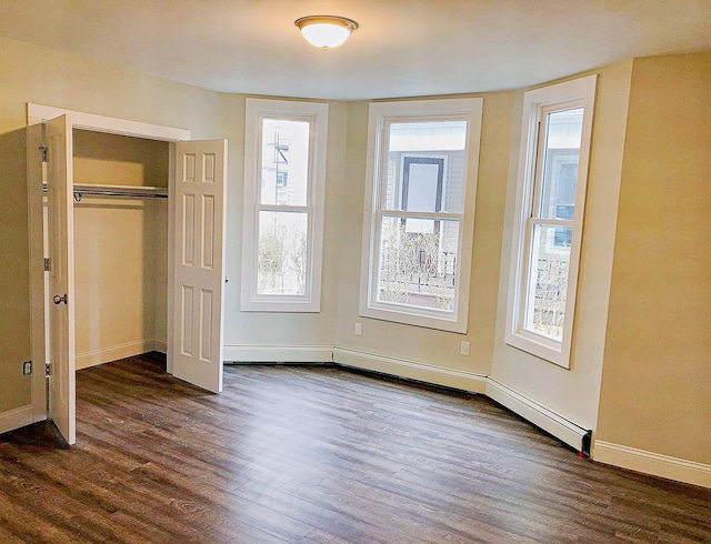 114 Park Ave, Mount Vernon, NY 10550 - unfurnished bedroom with dark wood-style floors and a closet