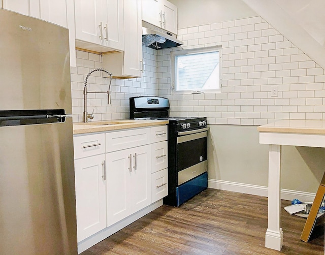 114 Park Ave, Mount Vernon, NY 10550 - kitchen with appliances with stainless steel finishes, under cabinet range hood, tasteful backsplash, light countertops, and white cabinets