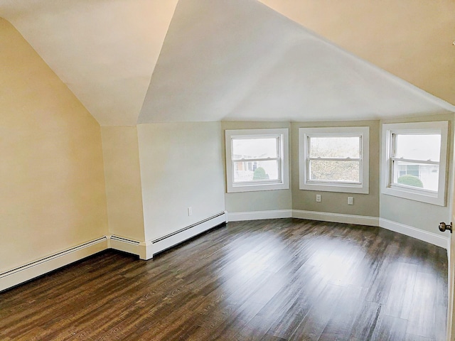 114 Park Ave, Mount Vernon, NY 10550 - additional living space with dark wood finished floors, lofted ceiling, and a baseboard heating unit