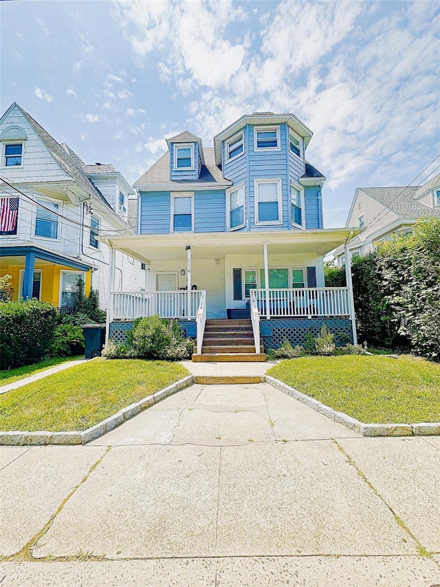 114 Park Ave, Mount Vernon, NY 10550 - victorian house with a porch and a front lawn