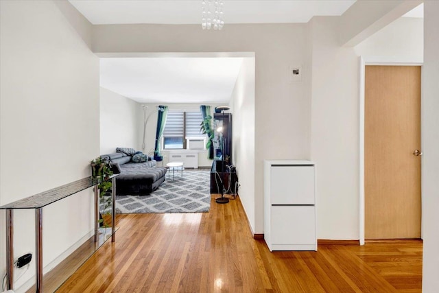 2615 Homecrest Ave Unit 1D, Brooklyn, NY 11235 - hallway featuring wood finished floors and a chandelier