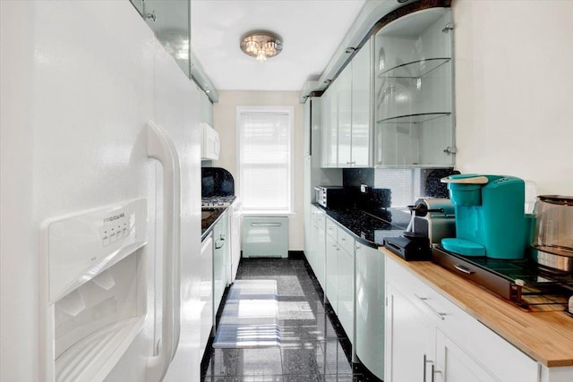 2615 Homecrest Ave Unit 1D, Brooklyn, NY 11235 - kitchen with white refrigerator with ice dispenser, white cabinets, and butcher block countertops