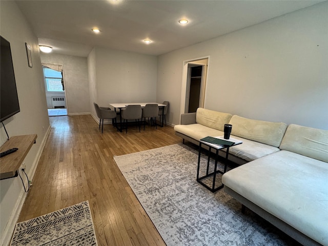 7827 Cloverdale Blvd Unit A, Oakland Gardens, NY 11364 - living room with wood-type flooring, recessed lighting, and radiator heating unit