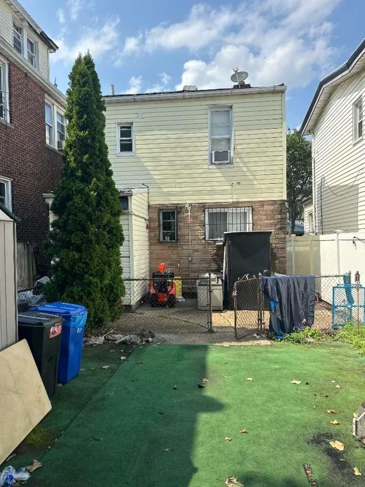 104-20 47th Ave, Corona, NY 11368 - rear view of property featuring stone siding