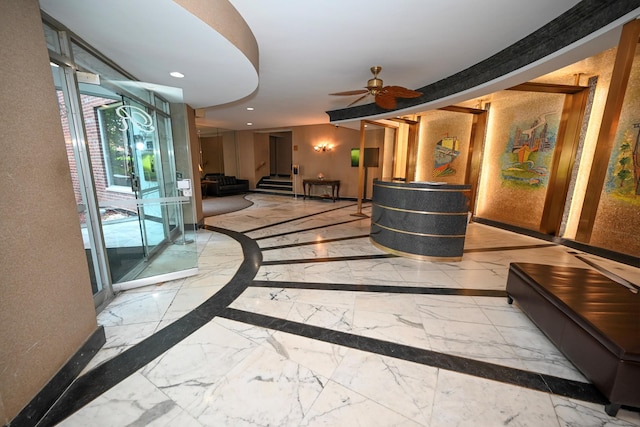 84-01 Main St Unit 410, Briarwood, NY 11435 - reception area with stairway, a ceiling fan, and recessed lighting