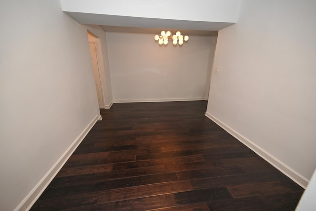 84-01 Main St Unit 410, Briarwood, NY 11435 - corridor featuring wood finished floors and a chandelier