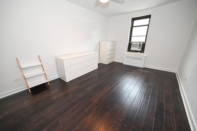 84-01 Main St Unit 410, Briarwood, NY 11435 - unfurnished bedroom with radiator heating unit, hardwood / wood-style flooring, cooling unit, and a ceiling fan