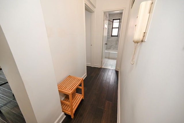 84-01 Main St Unit 410, Briarwood, NY 11435 - corridor with baseboards and dark wood-style flooring