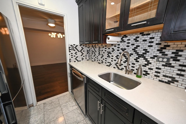 84-01 Main St Unit 410, Briarwood, NY 11435 - kitchen with light countertops, arched walkways, glass insert cabinets, dishwasher, and decorative backsplash