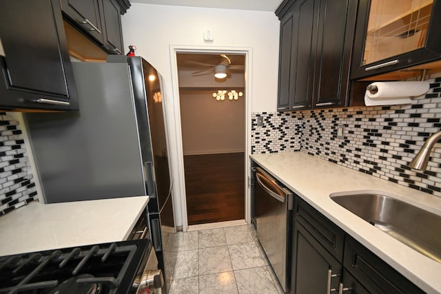 84-01 Main St Unit 410, Briarwood, NY 11435 - kitchen with appliances with stainless steel finishes, light countertops, decorative backsplash, and ceiling fan